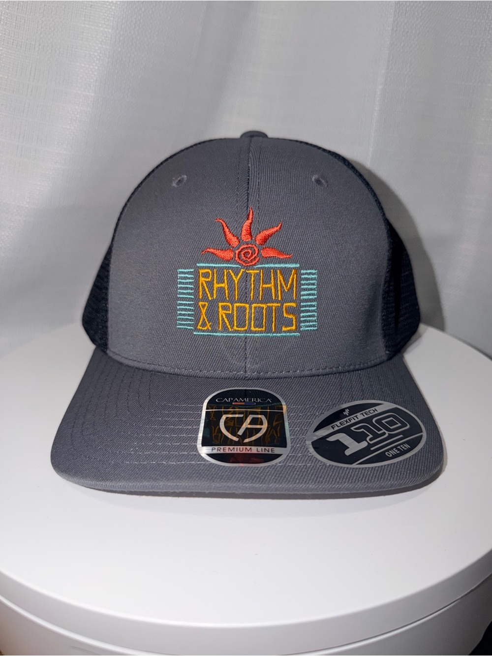 Rhythm & Roots Embroidered Trucker Hat - Gray with Orange & Teal Logo